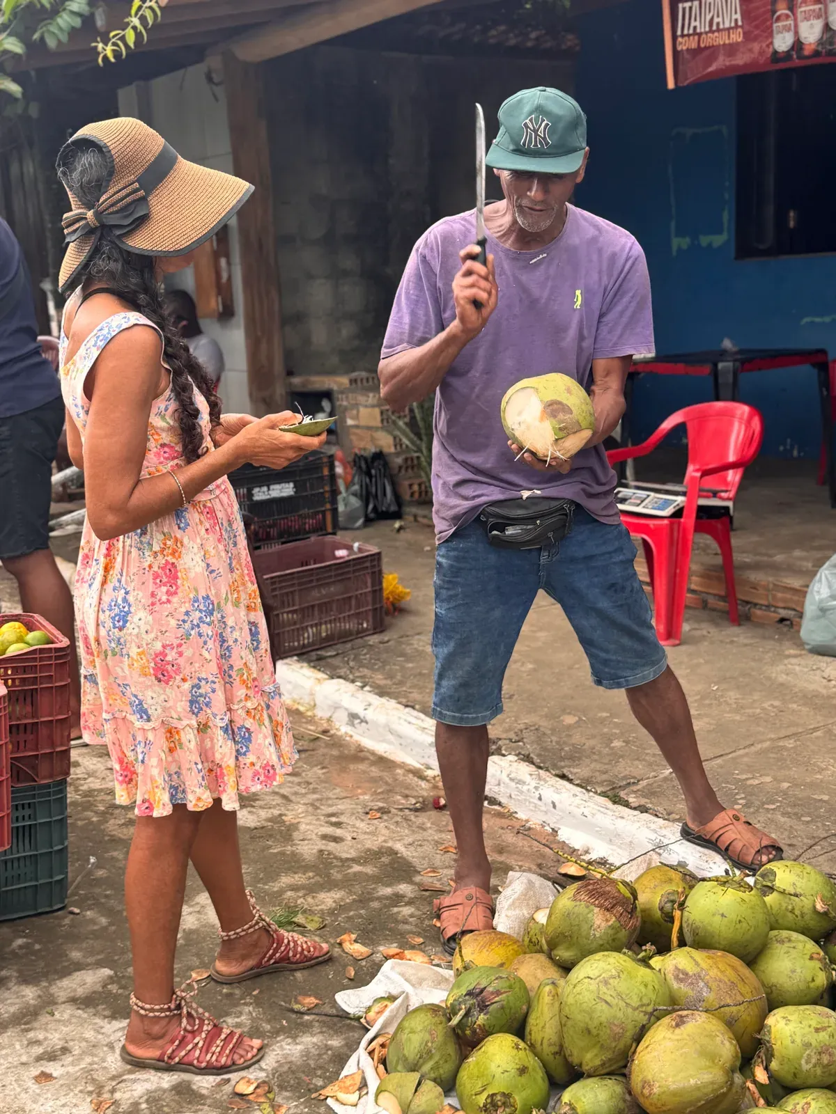 Choosing fresh coconuts at the feira
