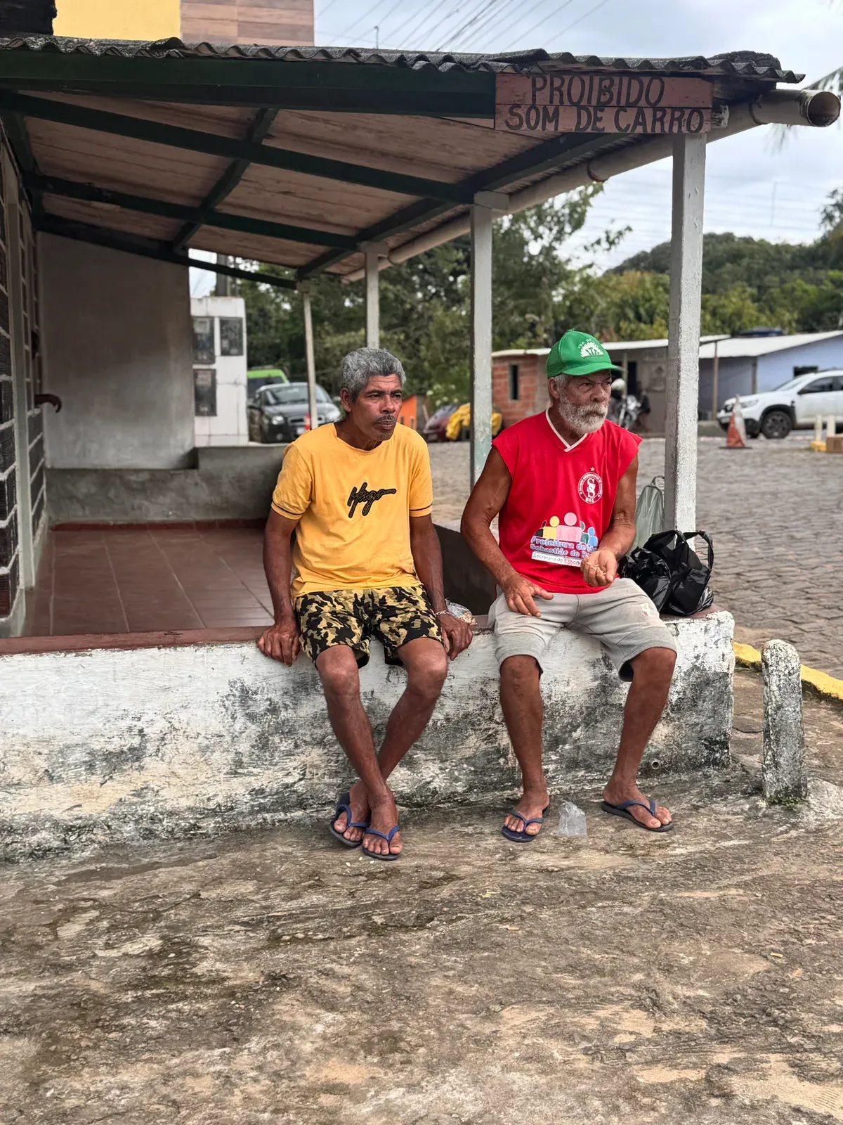 Two men talking in a quiet corner of town